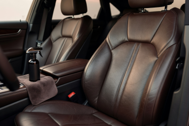 Genuine leather car seats in a real vehicle cabin suited to leather conditioning care
