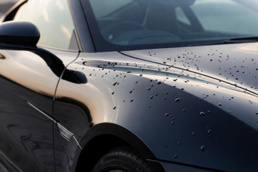 Glossy real car exterior paint finish highlighting ceramic coating style protection look